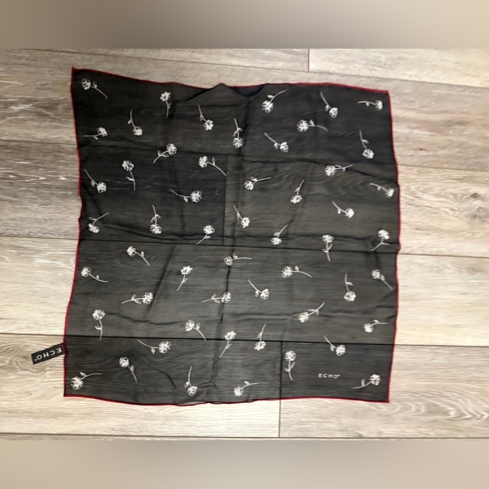 ECHO Small Black Sheer and stretch Scarf with white floral and red outline.